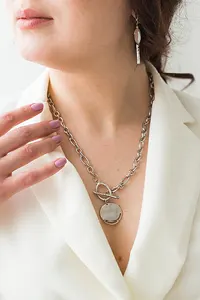 woman with white gold necklace and earrings woman with white gold necklace and earrings